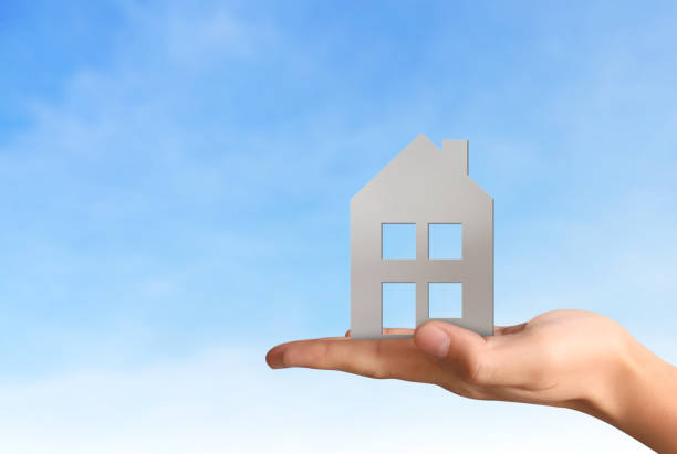 istock Mortgage concept by house from  hand 840188340
