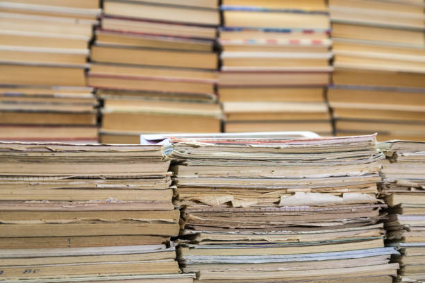 istock A stack of old school notebooks and a stack of textbooks or books 840198452
