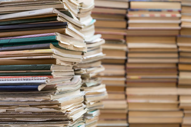 istock A stack of old school notebooks and a stack of textbooks or books 840198602