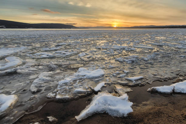 istock sunset over Deer Lake Icy shore 840201358