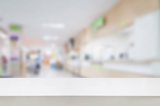 istock Empty white desk with blur hospital background 840202102