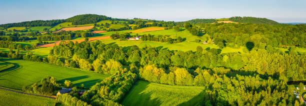 aerial panorama over vibrant green meadows farms fields picturesque countryside - river usk imagens e fotografias de stock