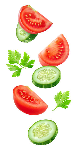 istock Flying slices of tomato and cucumber 840202524