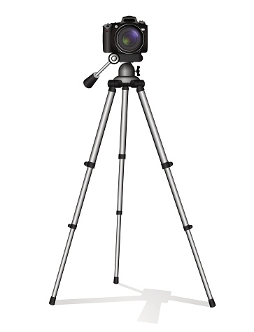 SLR camera on a tripod. Metal construction. Take a photo, movie or video