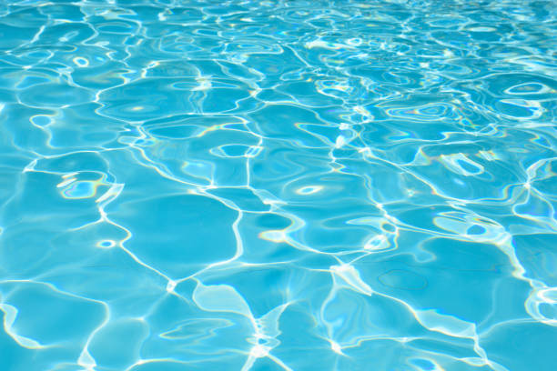 istock Blue and bright ripple water and surface in swimming pool 840206386