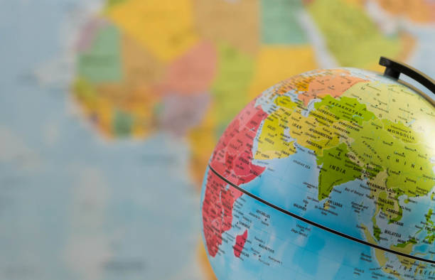 India and the world an earth globe focused on India with a blurred world map background country geographic area photos stock pictures, royalty-free photos & images