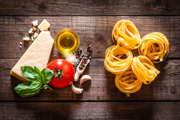 istock Tagliatelle pasta with ingredients on rustic wooden table 840215984