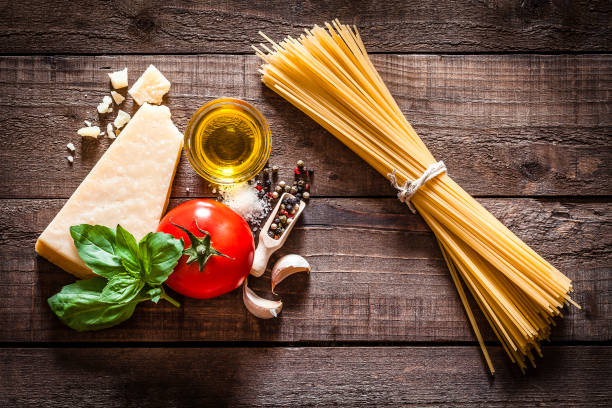 istock Spaghetti with ingredients on rustic wooden table 840216004