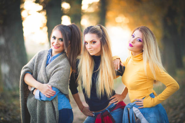 Beauty of feminine, beautiful women concept. Two attractive women posing together, blonde and brunette.