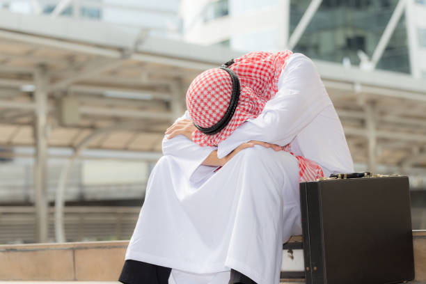 istock Stressed of Muslim man sitting on ground 840222536