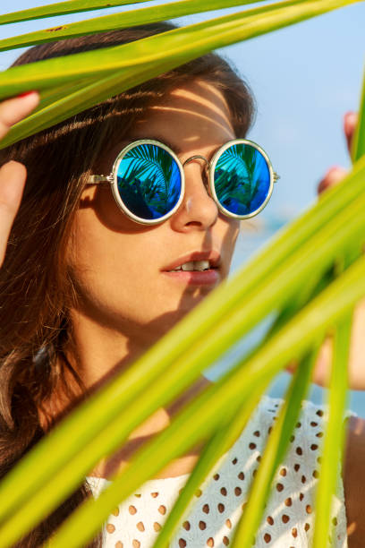 istock Sexy girl look thru palm leave. 840223206