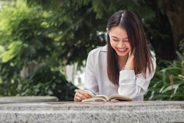 istock Asian woman study book in the park 840226562