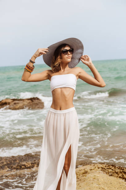 istock Pretty lady in summer outfit on the beach. 840227138