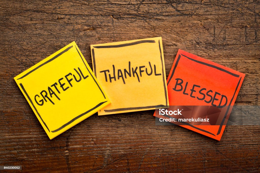Grateful, thankful, blessed  spiritual words Grateful, thankful, blessed  spiritual words - handwriting in black ink on sticky notes against rustic wood Gratitude Stock Photo
