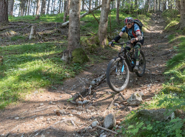 istock Mountainbiking with electric bicycle on a bumpy single trail, Austria. 840231594