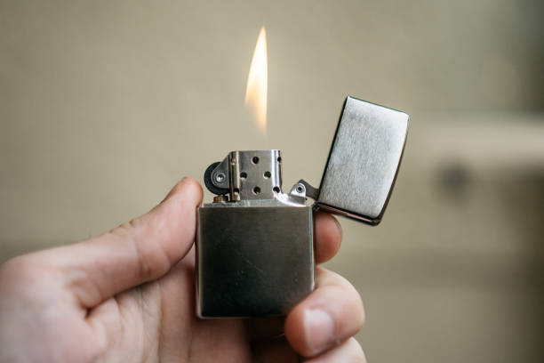 zippo lightner with small fire stock photo