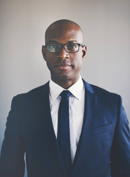 istock Focused young African executive wearing a suit and glasses 840237464