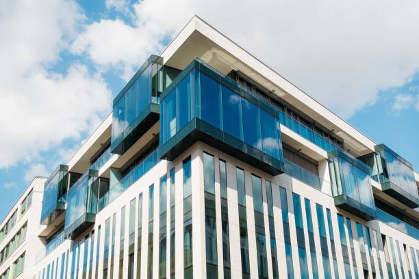 istock modern corner building with big glass facade 840237484