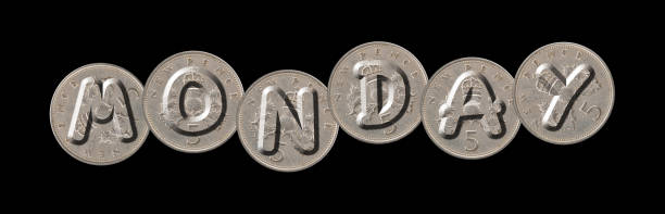istock MONDAY  –  Five new pence coins on black background 840237768
