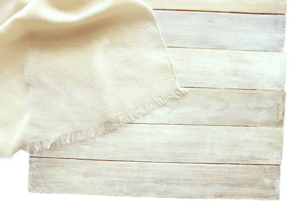 istock Knitted material and grunge wood board isolated on white background. 840241344