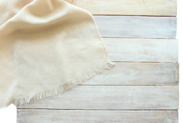 istock Knitted material and grunge wood board isolated on white background. 840241442