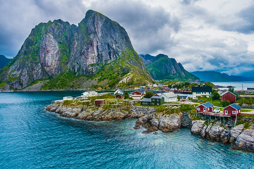 Reine, Lofoten Islands, Nordland, Norway. Located north of the Arctic Circle. Known for its natural beauty, distinctive scenery with dramatic mountains and peaks, open sea and sheltered bays, beaches and untouched lands as well as quaint picturesque villa