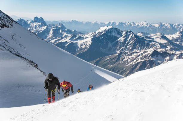 istock High-altitude tourists climb the mountain 840244620