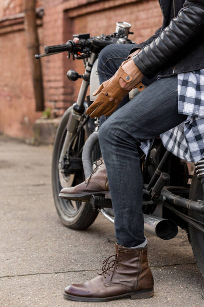 istock Brutal man sit on cafe racer custom motorbike. 840247148