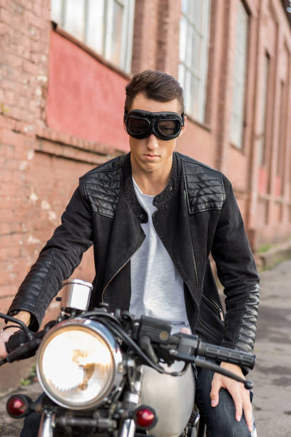 istock Brutal man sit on cafe racer custom motorbike. 840249910