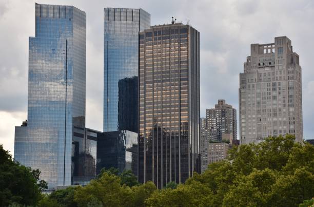 Time Warner Center in Manhattan July 1, 2017; Manhattan, New York, USA: The Time Warner Center and 1 Central Park West skyscrapers along Central Park in New York City. time warner center columbus circle pictures stock pictures, royalty-free photos & images