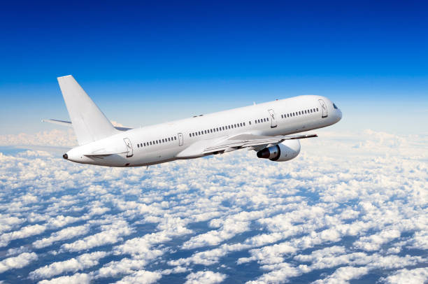 istock Airplane in the sky above the clouds flight journey sun height 840258788
