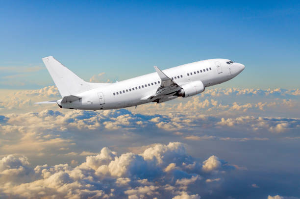 istock Airplane in the sky above the clouds flight journey sun height 840258790
