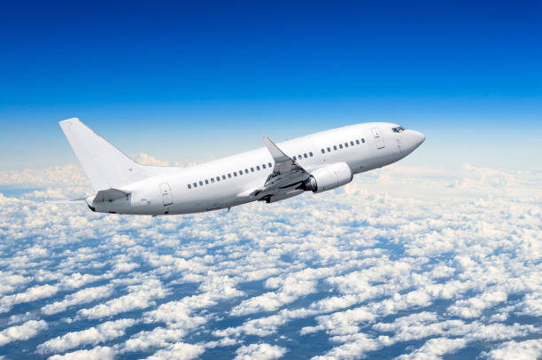 istock Airplane in the sky above the clouds flight journey sun height 840258792