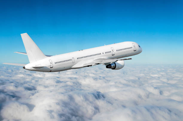istock Airplane in the sky above the clouds flight journey sun height 840258808