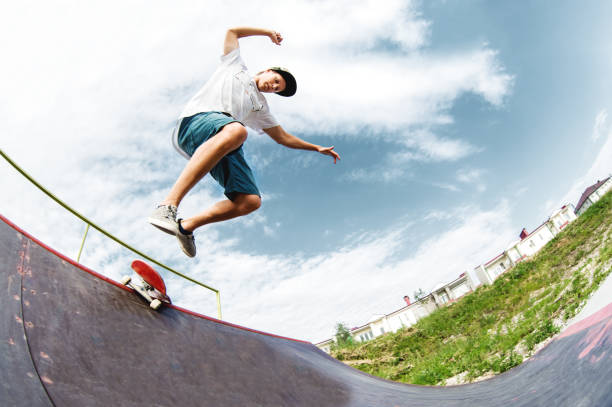 istock Young skater jumps from ramp down 840261764