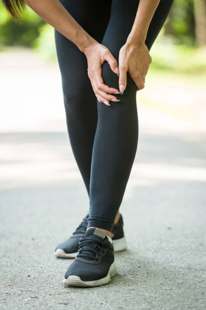 istock woman knee pain in a park 840264676