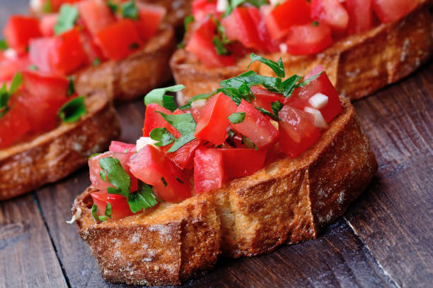 istock Bruschetta with garlic and tomatoes on table 840264744