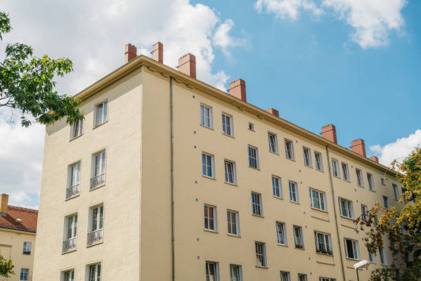 istock orange industrial house with chimneys 840269948