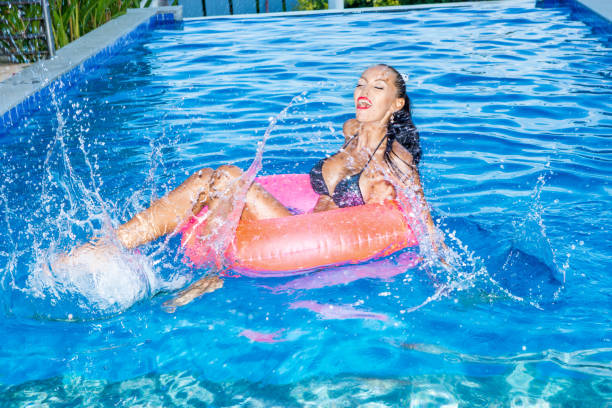 istock Sexy lady with long legs at the pool. 840272494