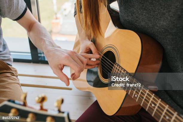Learning To Play The Guitar Music Education And Extracurricular Lessons Stock Photo - Download Image Now