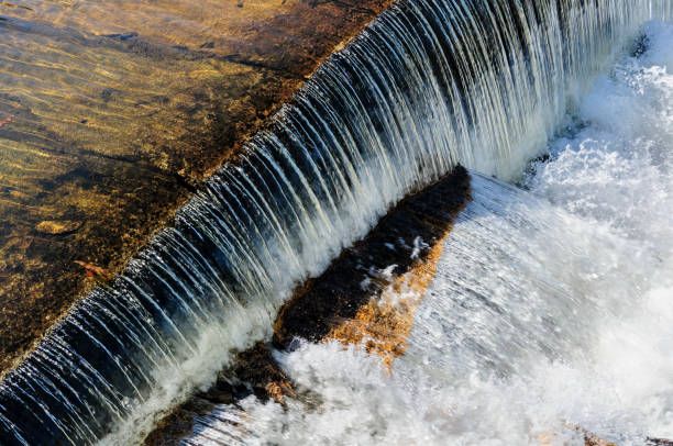 istock Water pouring over dam lip 840272864