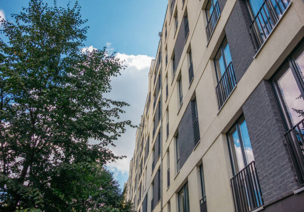 istock modern apartment building with brick ornaments and green tree 840275414