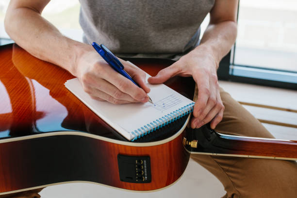 istock Learning to play the guitar. Music education and extracurricular lessons. 840278694