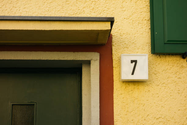 istock number seven next to an green door and window 840279582