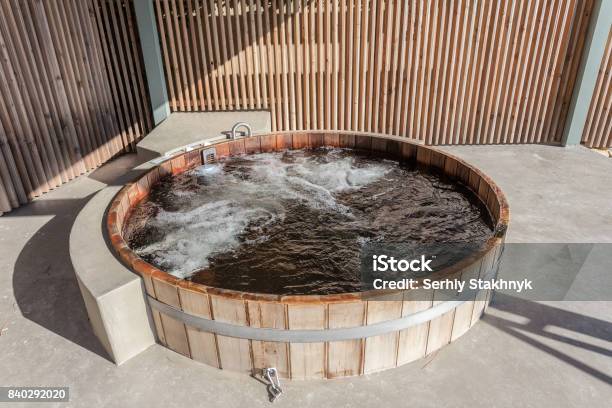 Wooden Hot Tub Is Filled With Water On Outdoor Stock Photo - Download Image Now - Hot Tub, Wood - Material, Circle