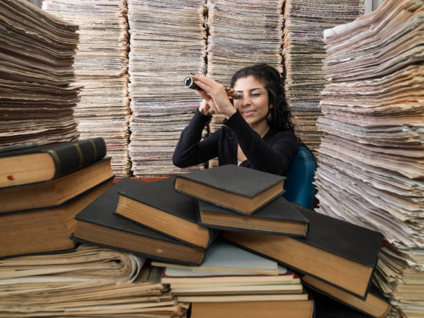 Young Mixed Race Woman Doing Research In Library