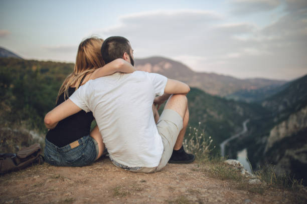 istock Couple on mountain together 840306934