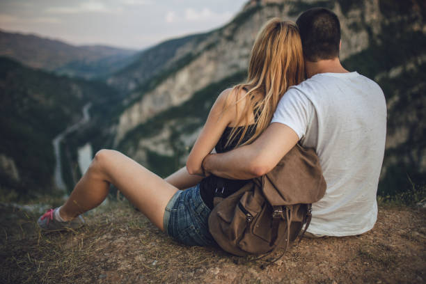 istock Couple relaxing on mountain 840307210