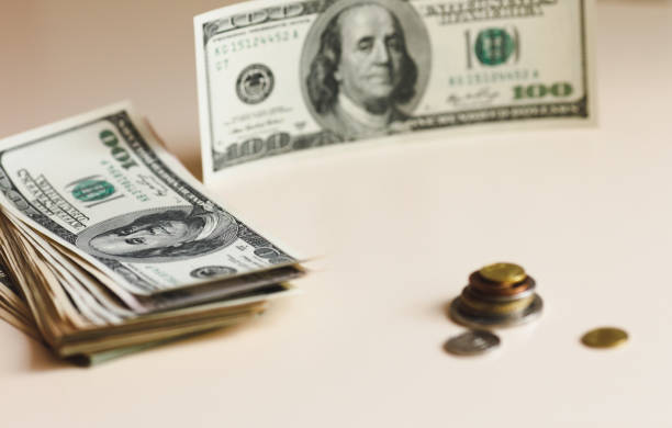 istock One hundred-dollar bills isolated on a white background 840319370