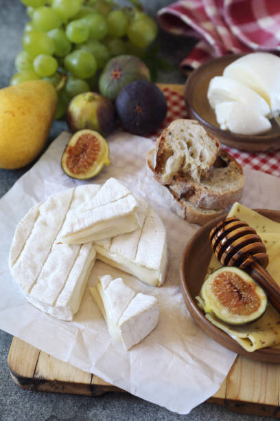 istock Goat cheese, fruits, mozzarella and bread 840319772